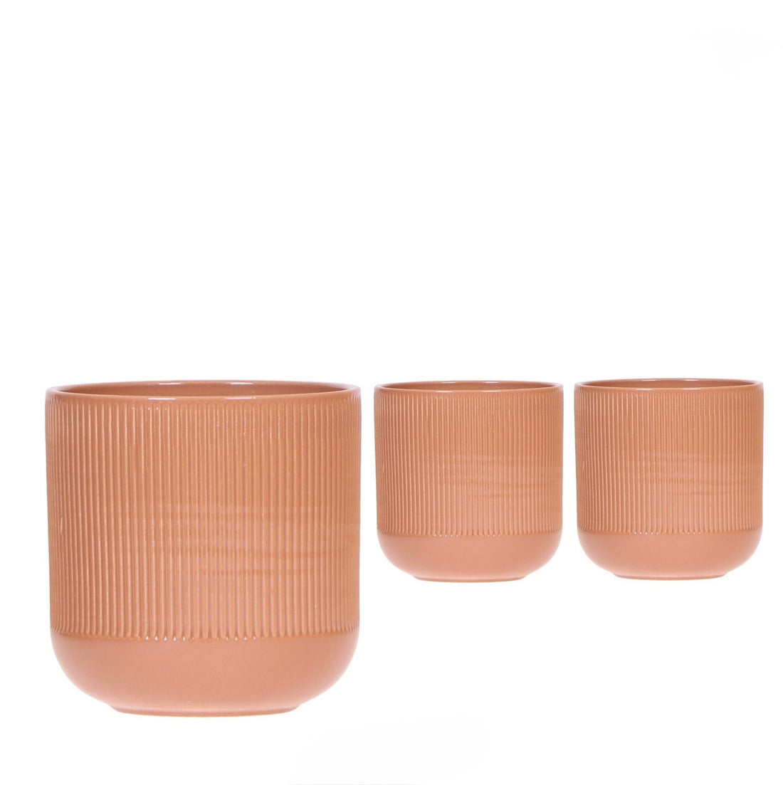 Coprivaso di design in ceramica con lavorazione scanalata plissé color terracotta per piante da interno.